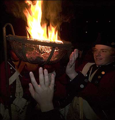 Warming hands by a cresset cw grand illumination and first night